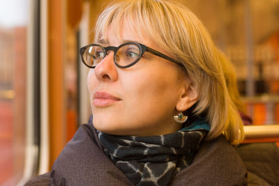 Close-up of woman wearing eyeglasses