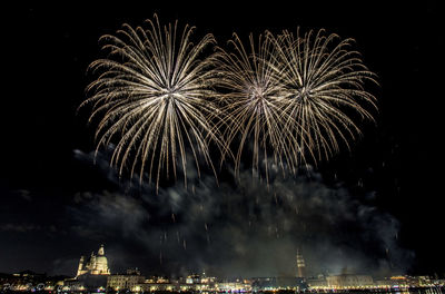 Firework display in sky at night