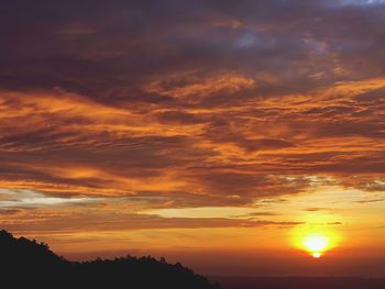 Low angle view of dramatic sky during sunset