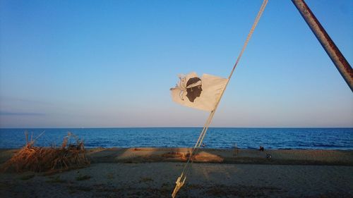 Scenic view of beach against clear sky