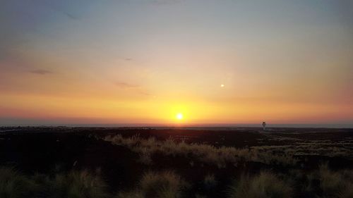 Scenic view of silhouette landscape against sky during sunset