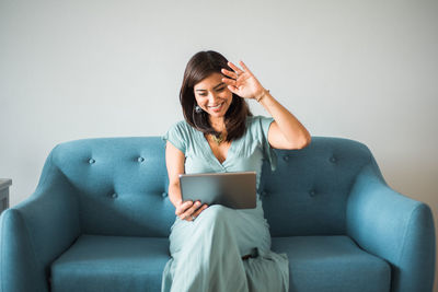 Teacher greets her class with her device from home