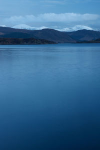 Scenic view of sea against blue sky