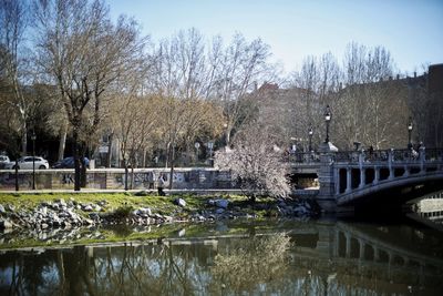 Bridge over river with buildings in background