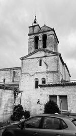 View of church and building against sky