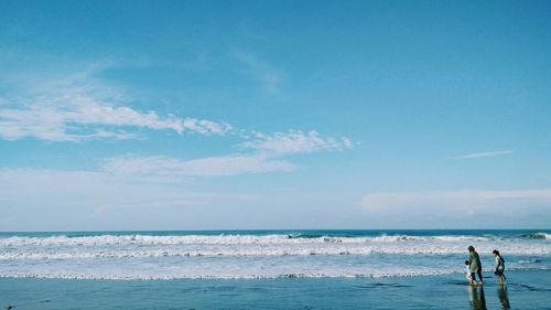 Scenic view of sea against blue sky