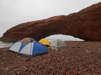 Tent on mountain against clear sky