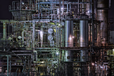 Full frame shot of smoke stacks at night