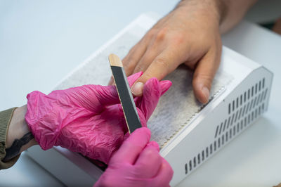 Cropped hand of person working at table