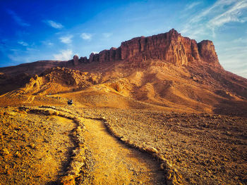 Rock formations on mountain against sky