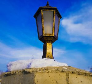 Low angle view of communications tower against sky during winter