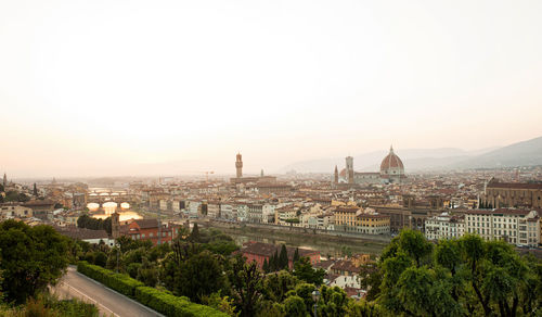 Golden sunset of palazzo vecchio and cathedral of santa maria del fiore, florence, italy.