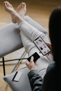 High angle view of woman using mobile phone