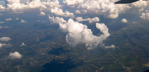 High angle view of smoke on land against sky