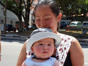 Close-up of happy young woman with son