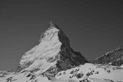 Scenic view of snow covered mountains