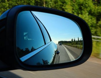Reflection of car on road