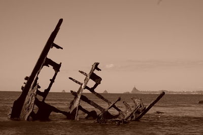 Ship on sea against sky during sunset