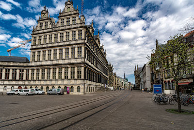 Street amidst buildings against sky in city