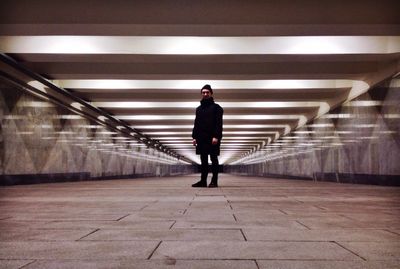 Man standing at illuminated basement