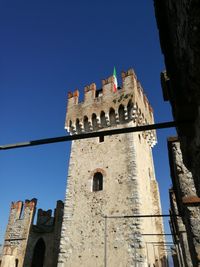 Low angle view of fort against blue sky