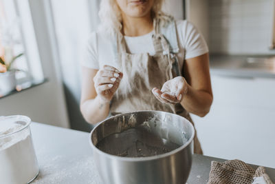 Woman baking in kitchen