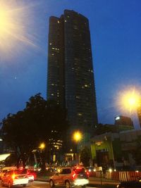 Low angle view of illuminated city at night