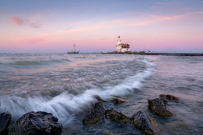 Scenic view of sea against cloudy sky