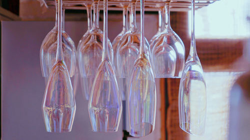 Close-up of glass hanging in row