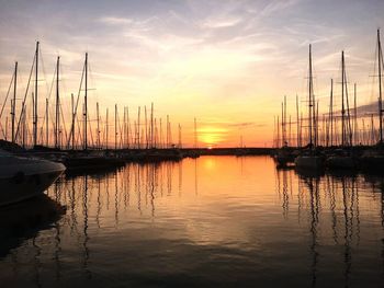 Sailboats in lake at sunset