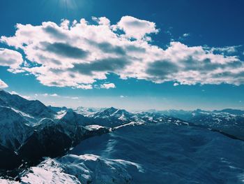 Scenic view of snowcapped mountains against sky