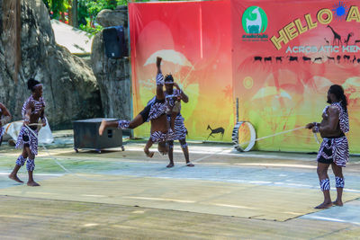 Full length of people playing in park