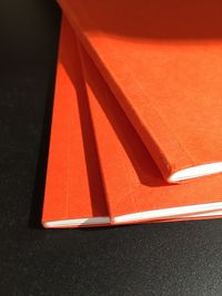 High angle view of orange books