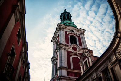 Low angle view of church against cloudy sky