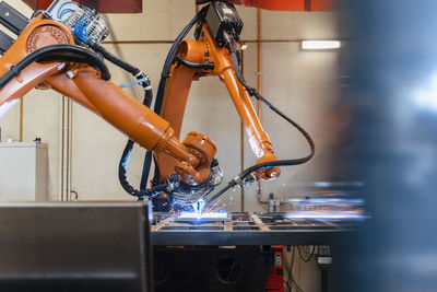 Robotic arms welding in industrial factory