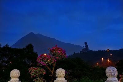 Scenic view of mountains against clear blue sky