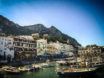 Boats moored at harbor