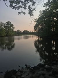 Scenic view of lake against sky during sunset