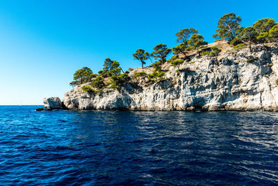 Scenic view of sea against clear blue sky