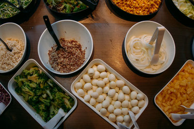 A delicious salad bar in a thai restaurant, quail eggs, pineapples, vegetables, and beans.