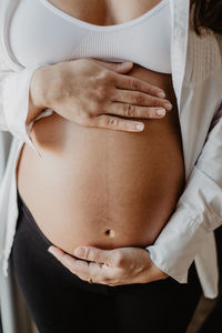 Close-up of woman touching head