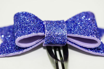 Close-up of purple shoes on table