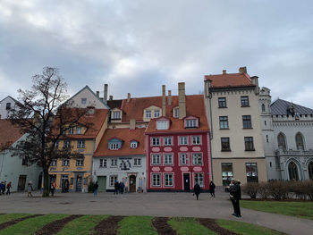 Buildings in town against sky