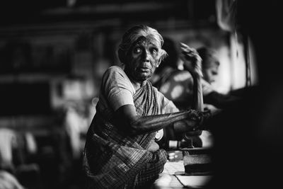 Man working with arms raised