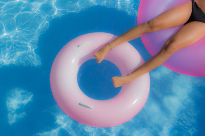 Low section of woman in swimming pool