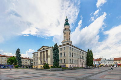 Drohobych, ukraine. town hall on the market square in drohobych, ukraine, on a summer day