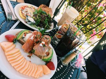 High angle view of food and drinks served on restaurant table