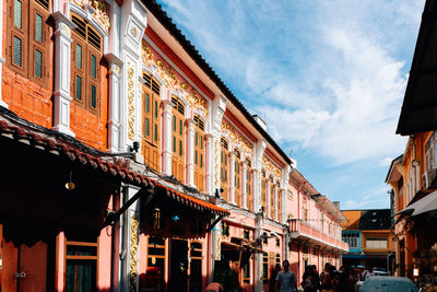 Low angle view of buildings against sky in city