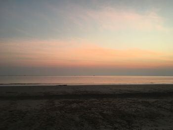 View of beach at sunset