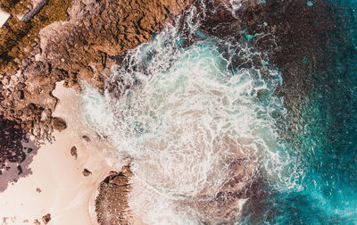 Sea waves splashing on rocks